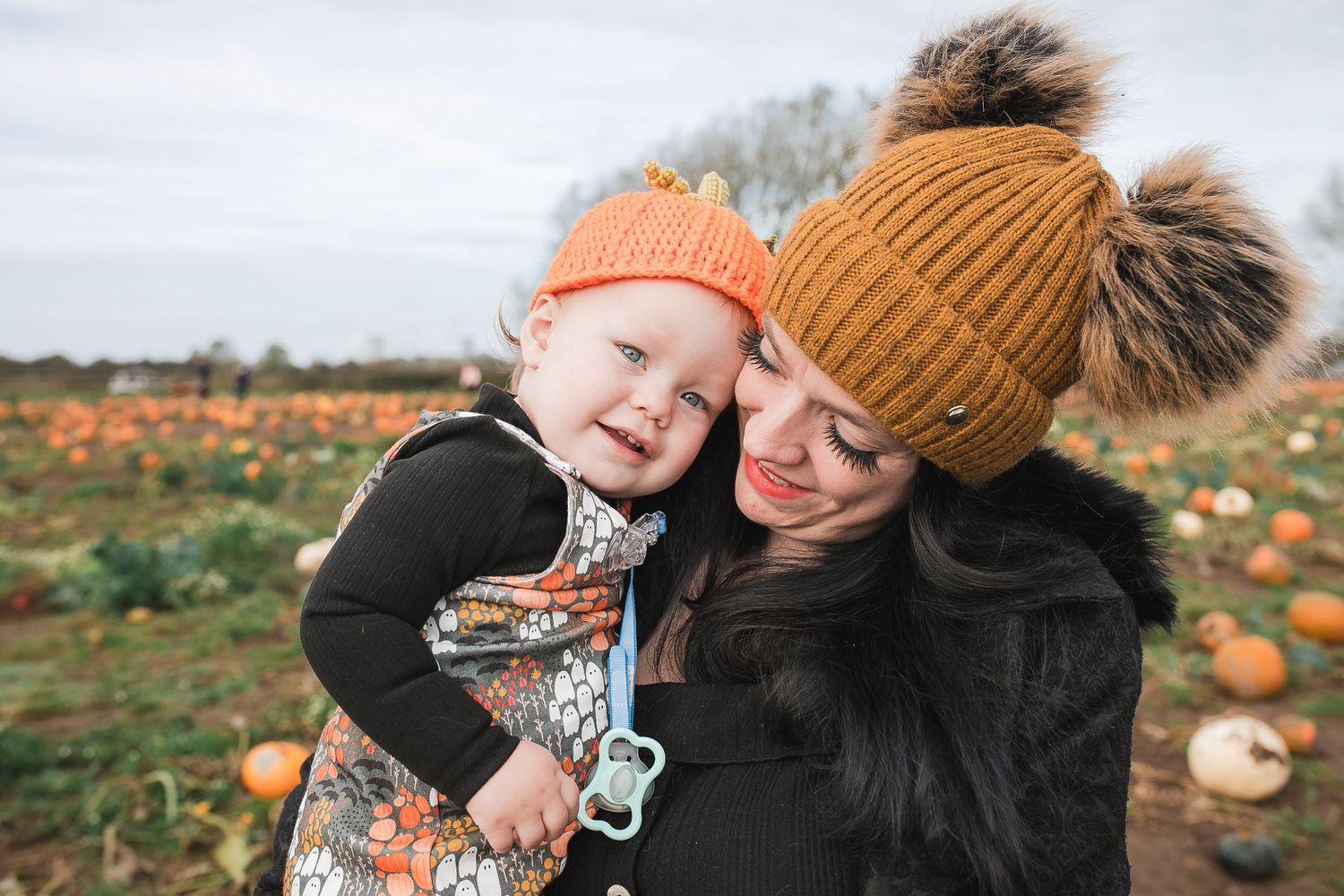 Joyful autumn family photoshoot in a field with pumpkins and sunflowers. Photographer. Hull. East Yorkshire. Photography