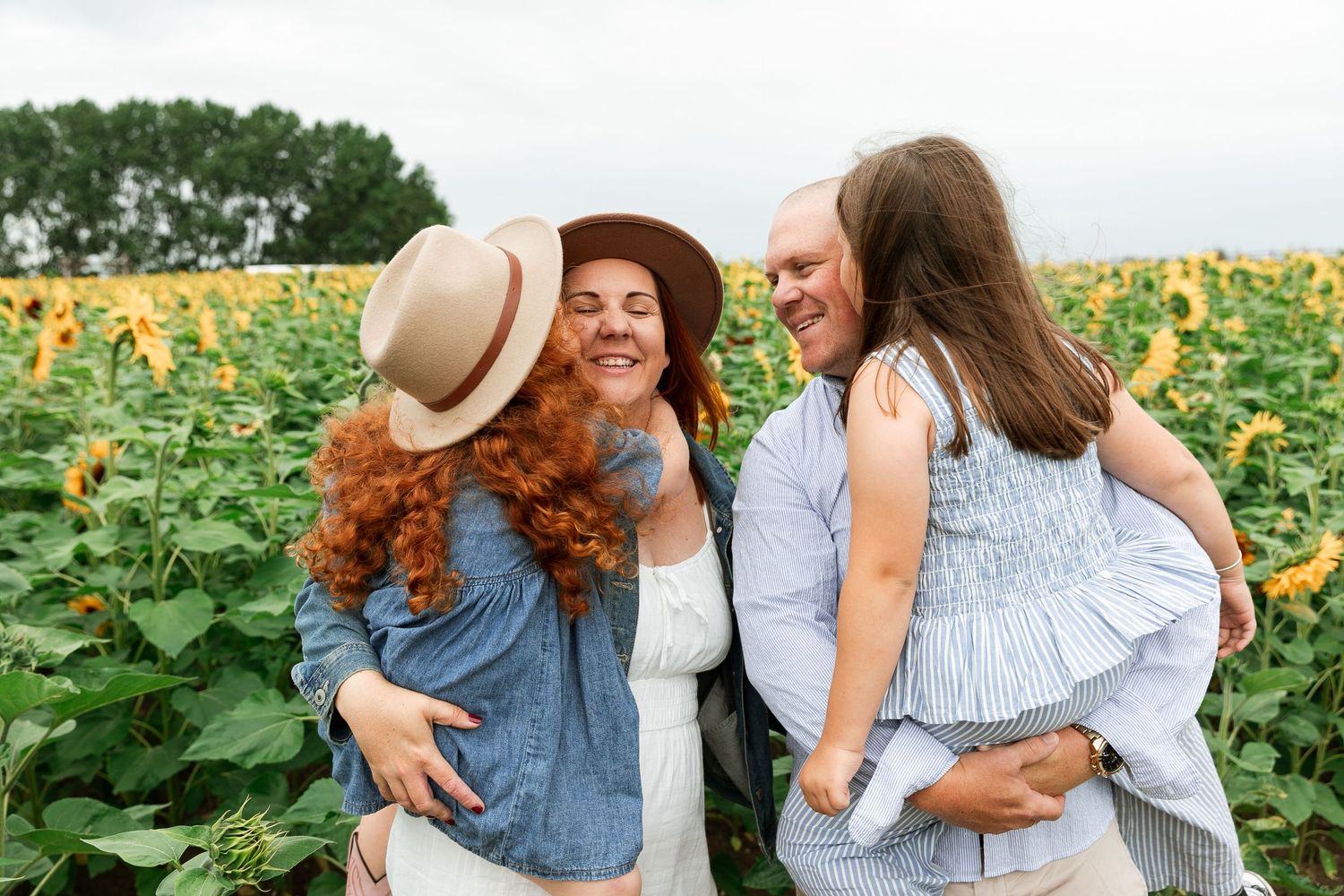 Candid moments captured in a blooming sunflower field on a bright afternoon.  Photographer. Hull. East Yorkshire. Photography