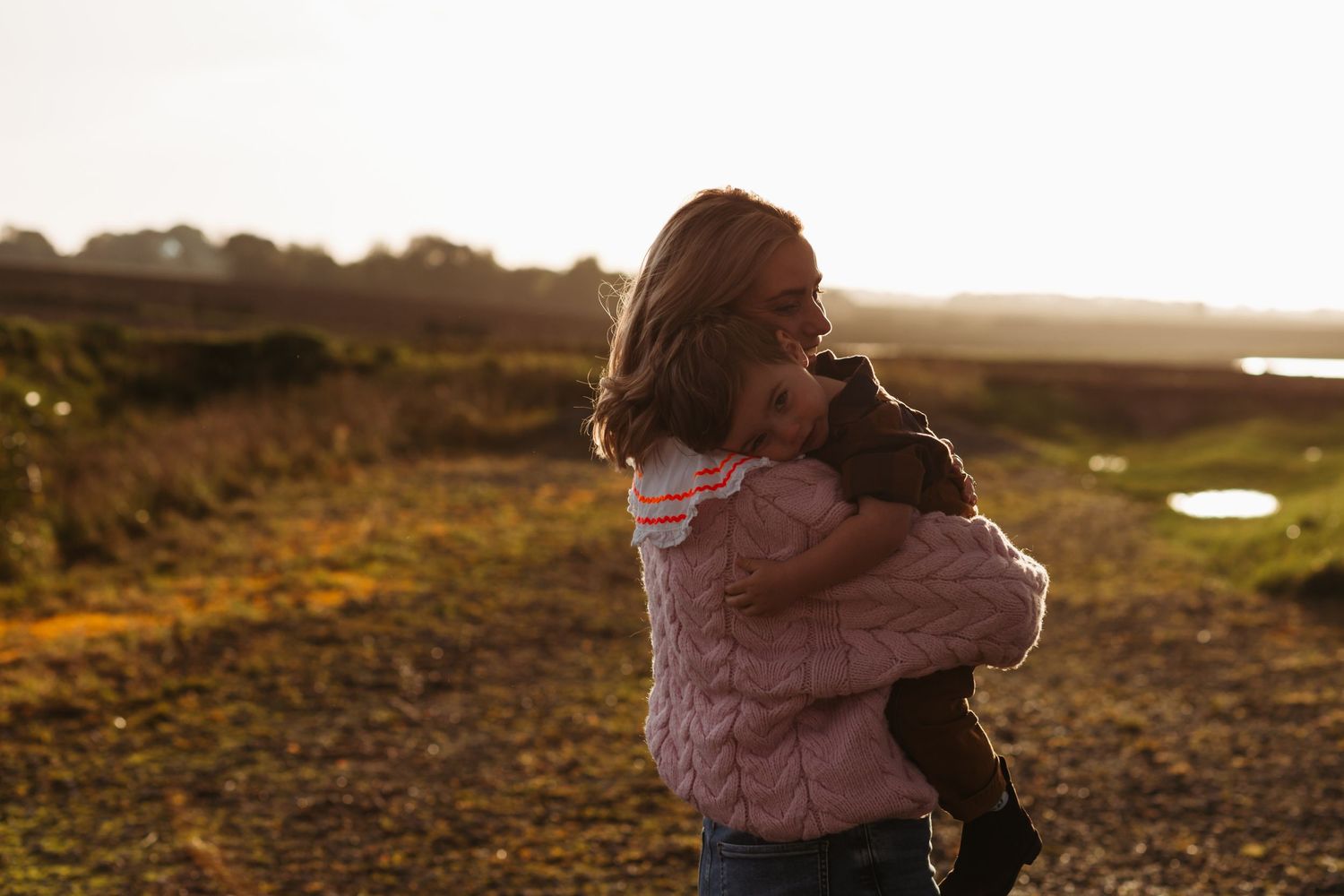 Silhouettes embrace during golden hour sunset in an outdoor setting. Photographer. Hull. East Yorkshire. Photography