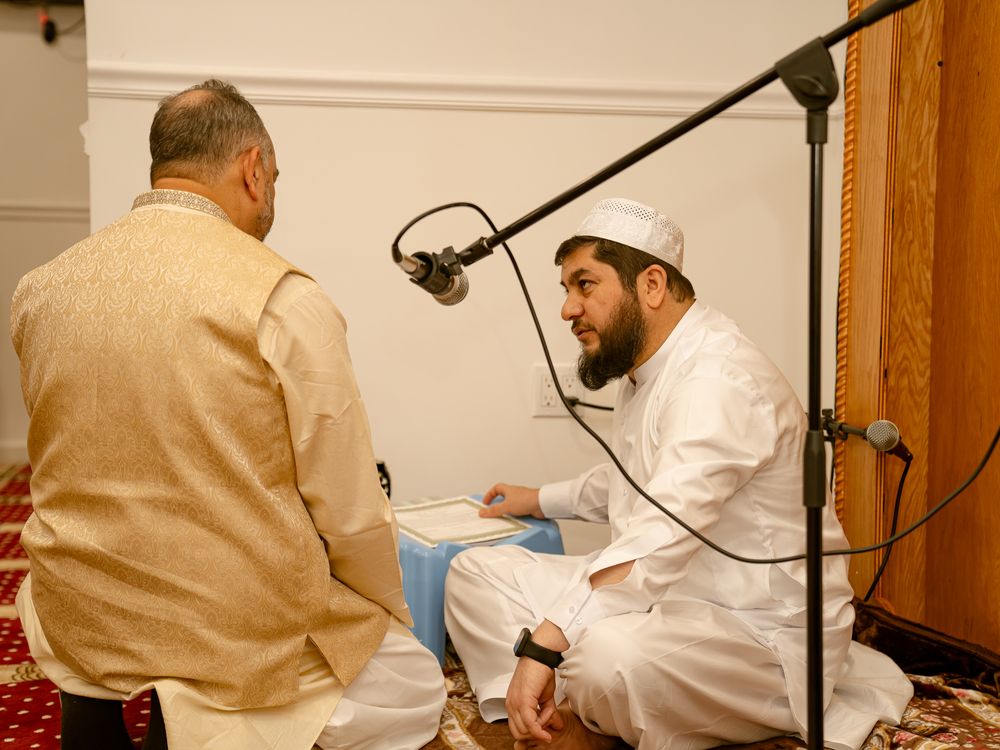 Religious ceremony with spiritual leaders conducting traditional rituals.