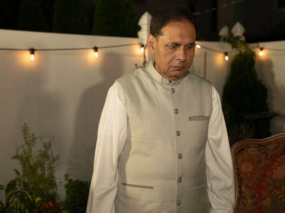 Evening outdoor wedding portraits featuring traditional South Asian formal attire.