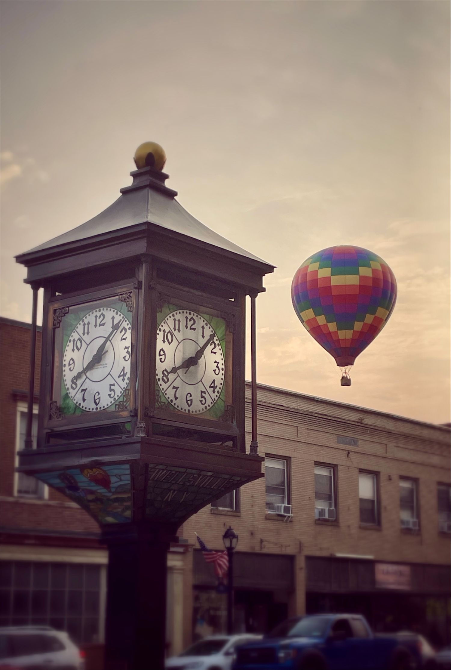 Silhouettes of people watching hot air balloons through windows in a sequence of photos.