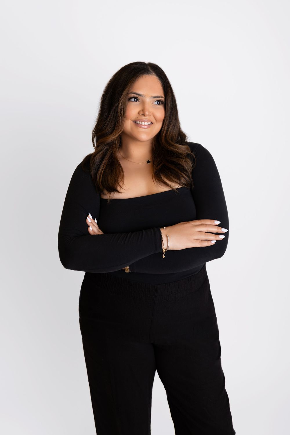 Confident female business owner posing for website and social media content.