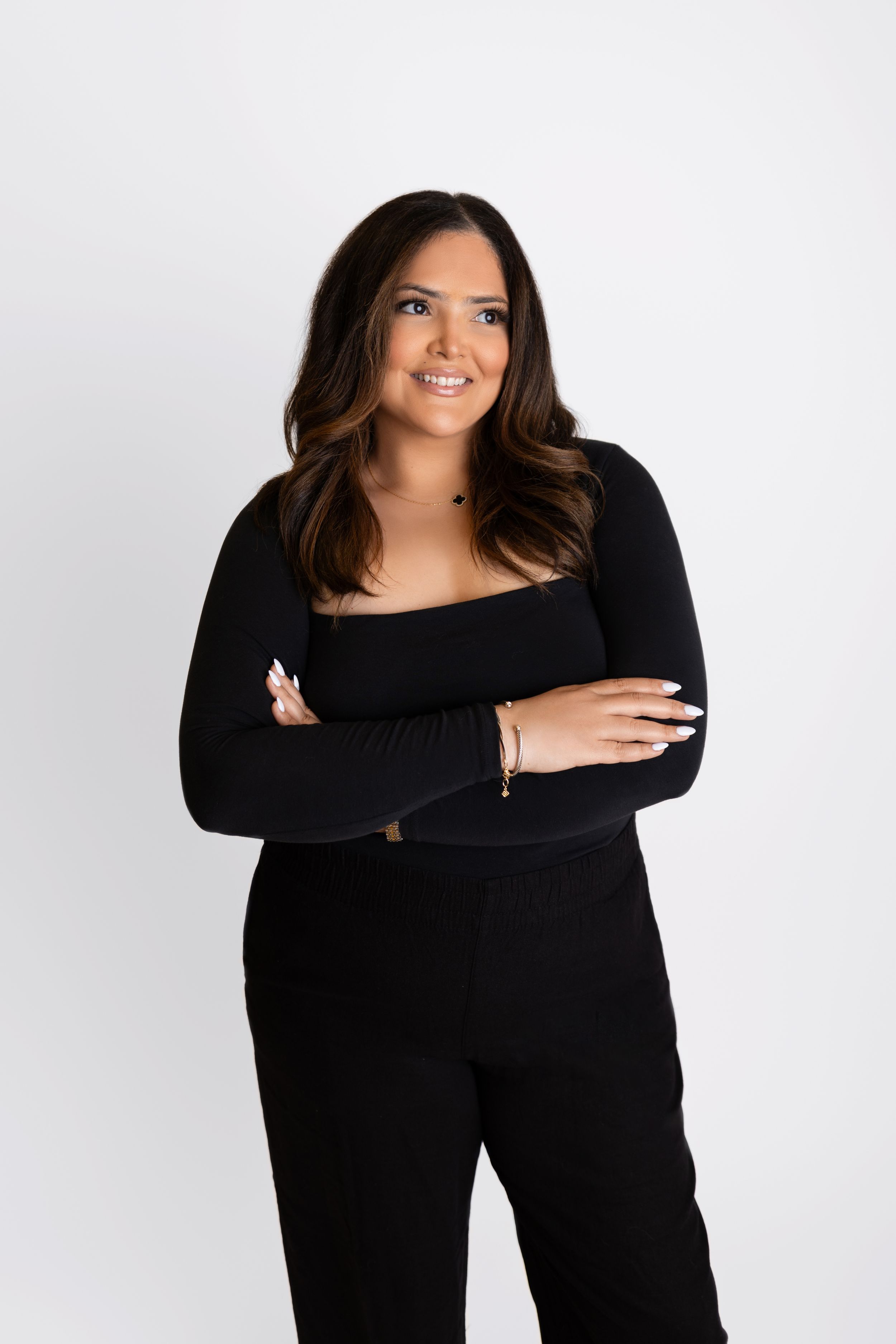 Confident female business owner posing for website and social media content.