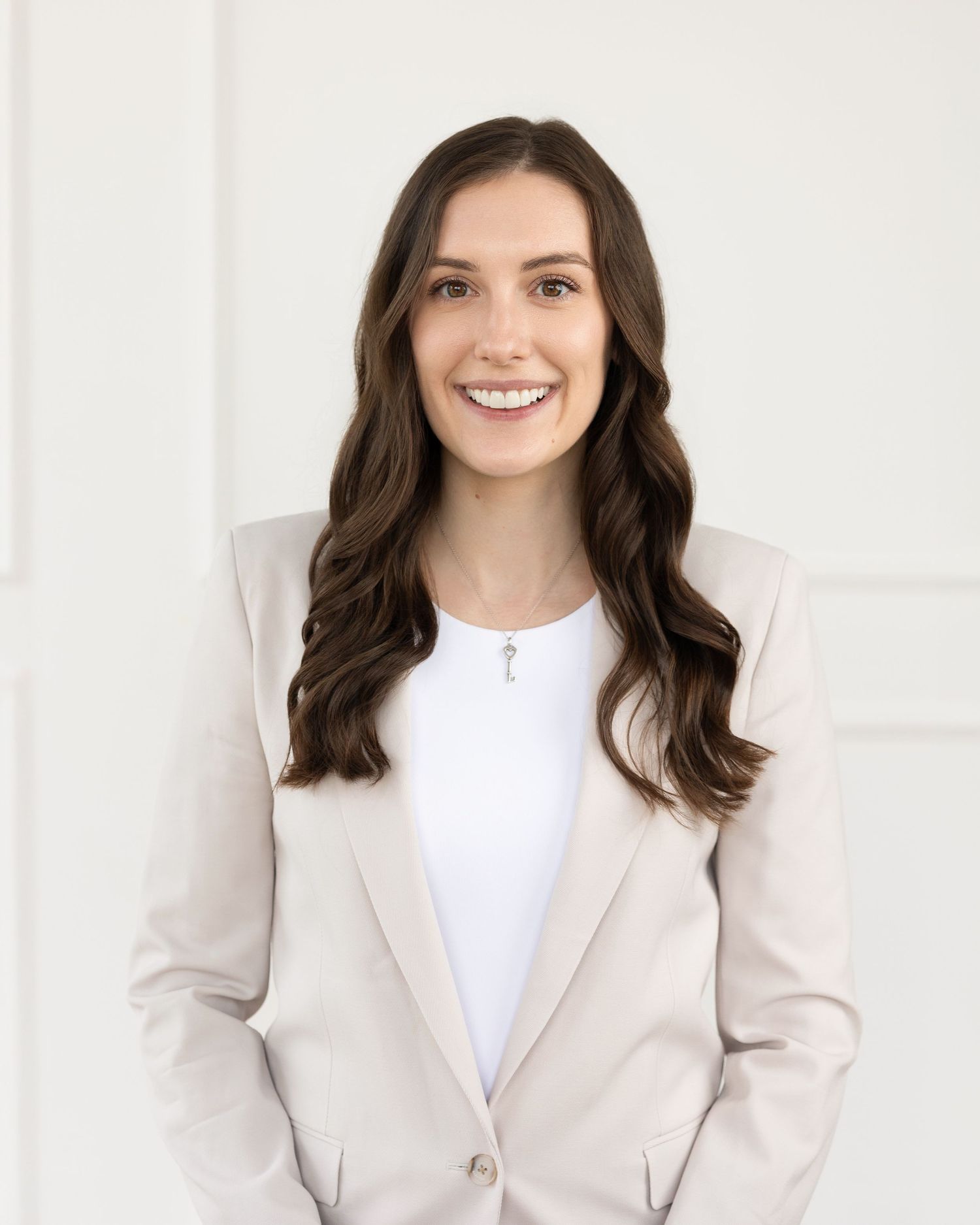 Client changing from corporate blazer to casual outfit during personal branding photoshoot in London Ontario