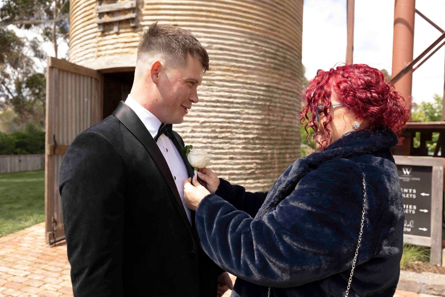 Mum helping groom adjust tie at Warrawong Estate Victoria