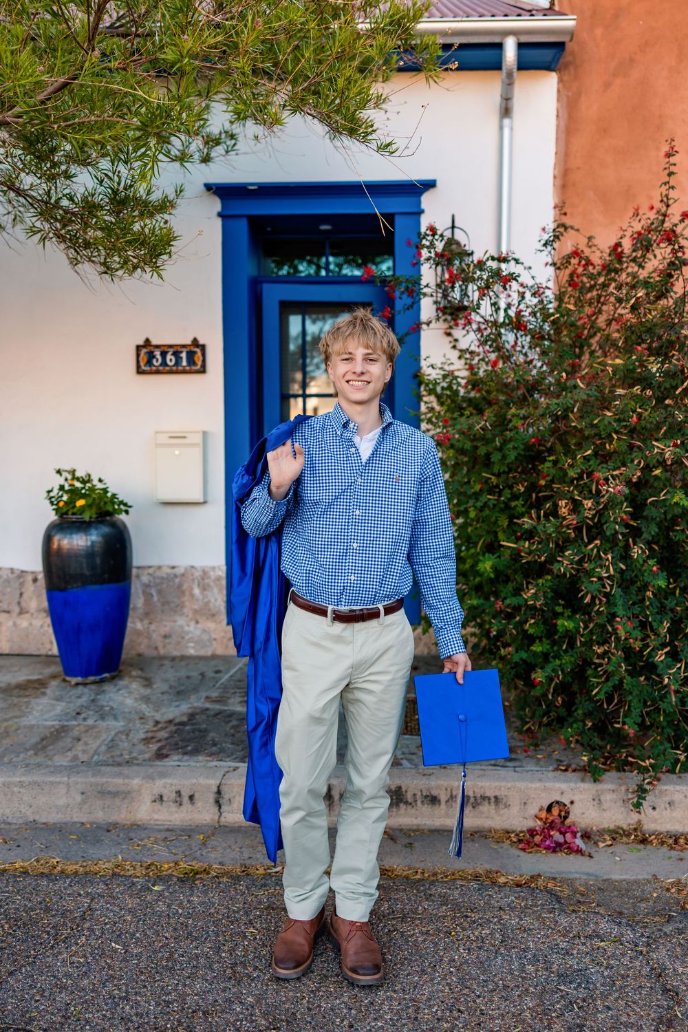 Tucson senior photographer male session with cap and gown in downtown Tucson- senior pictures