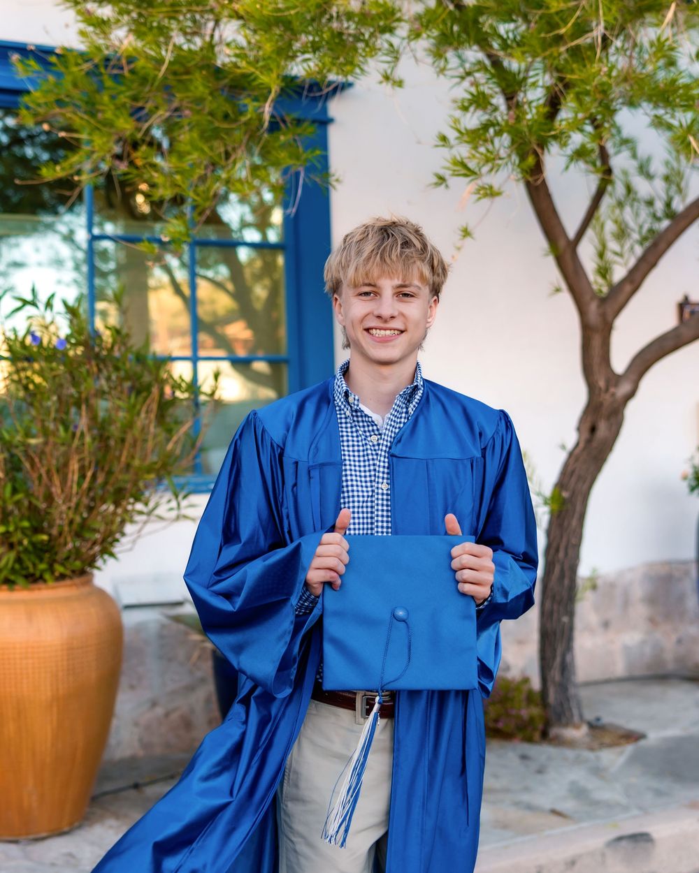 Tucson senior photographer male session with cap and gown in downtown Tucson- senior pictures