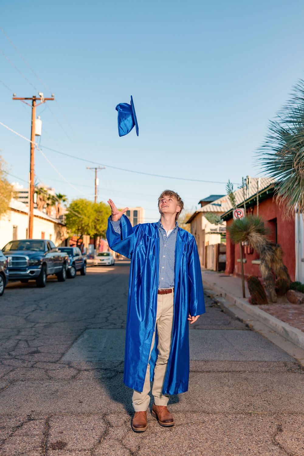 Tucson senior photographer male session with cap and gown in downtown Tucson- senior pictures