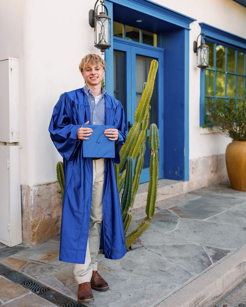 Tucson senior photographer male session with cap and gown in downtown Tucson- senior pictures