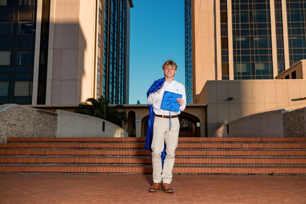 Tucson senior photographer male session with cap and gown in downtown Tucson- senior pictures