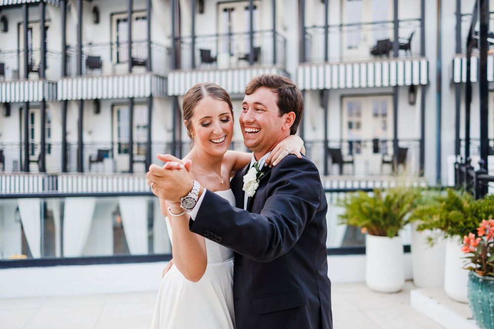 A romantic couple engaged in affectionate moments across a series of wedding photos at a stylish venue.