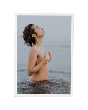 Artistic portrait capturing serene ocean scene with waves and mist.