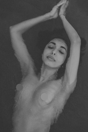 Dramatic black and white artistic portrait with stretched poses.