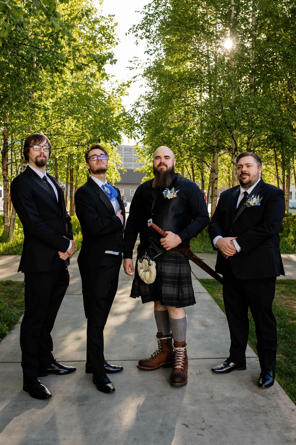 A sequence of fun groomsmen photos showing different sock patterns and dress shoes while lined up outdoors.