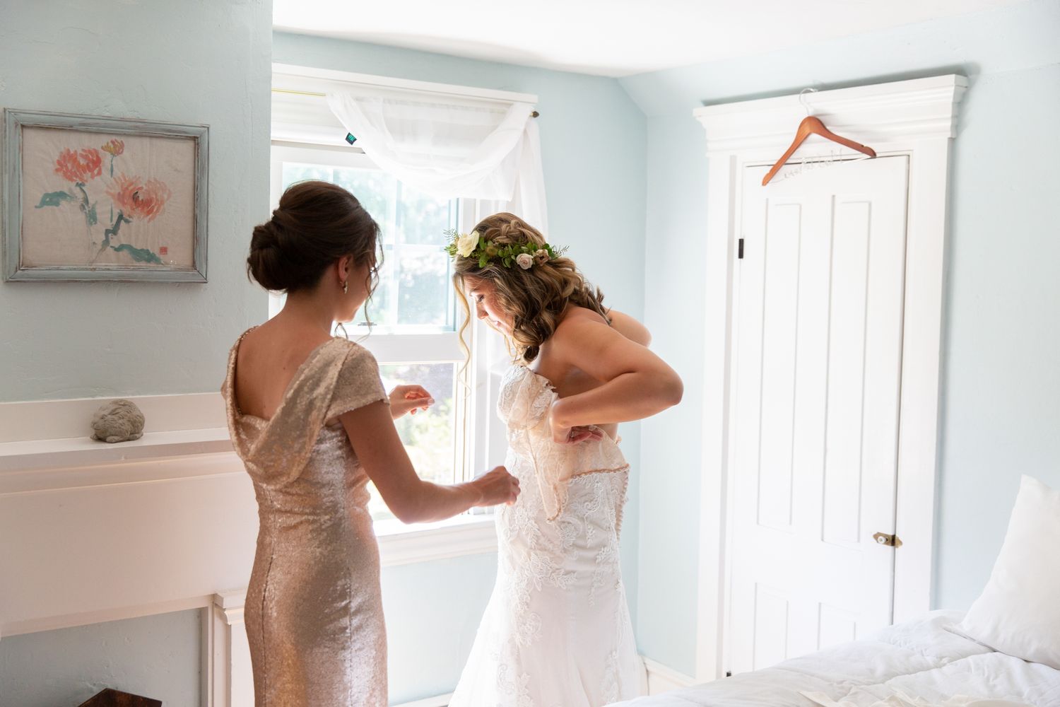 Light-filled room with people preparing for a special occasion.