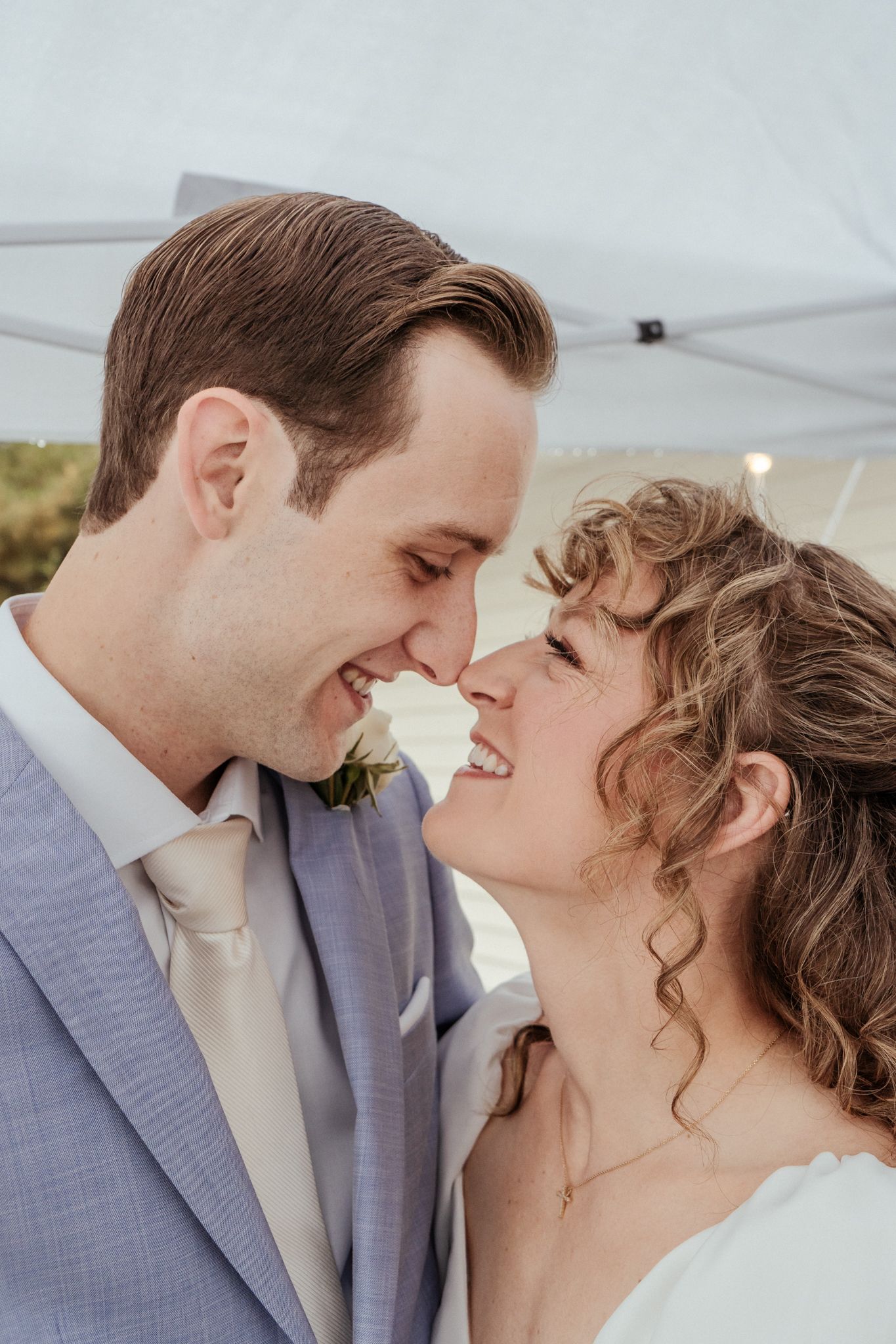 A romantic series of close-up wedding photos showing tender moments between newlyweds.