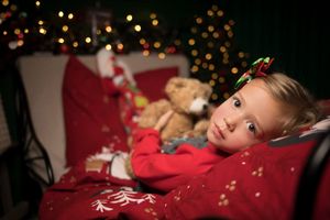 Holiday portrait with bokeh lights creating a magical Christmas atmosphere.