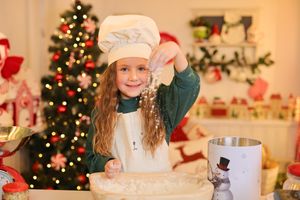 Holiday baking scene with chef hat and rolling pin in a Christmas-decorated kitchen.