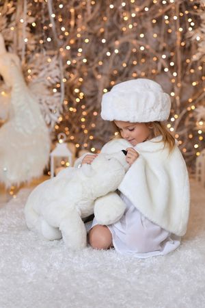 White winter scene with bokeh lights and soft textures on snowy backdrop.