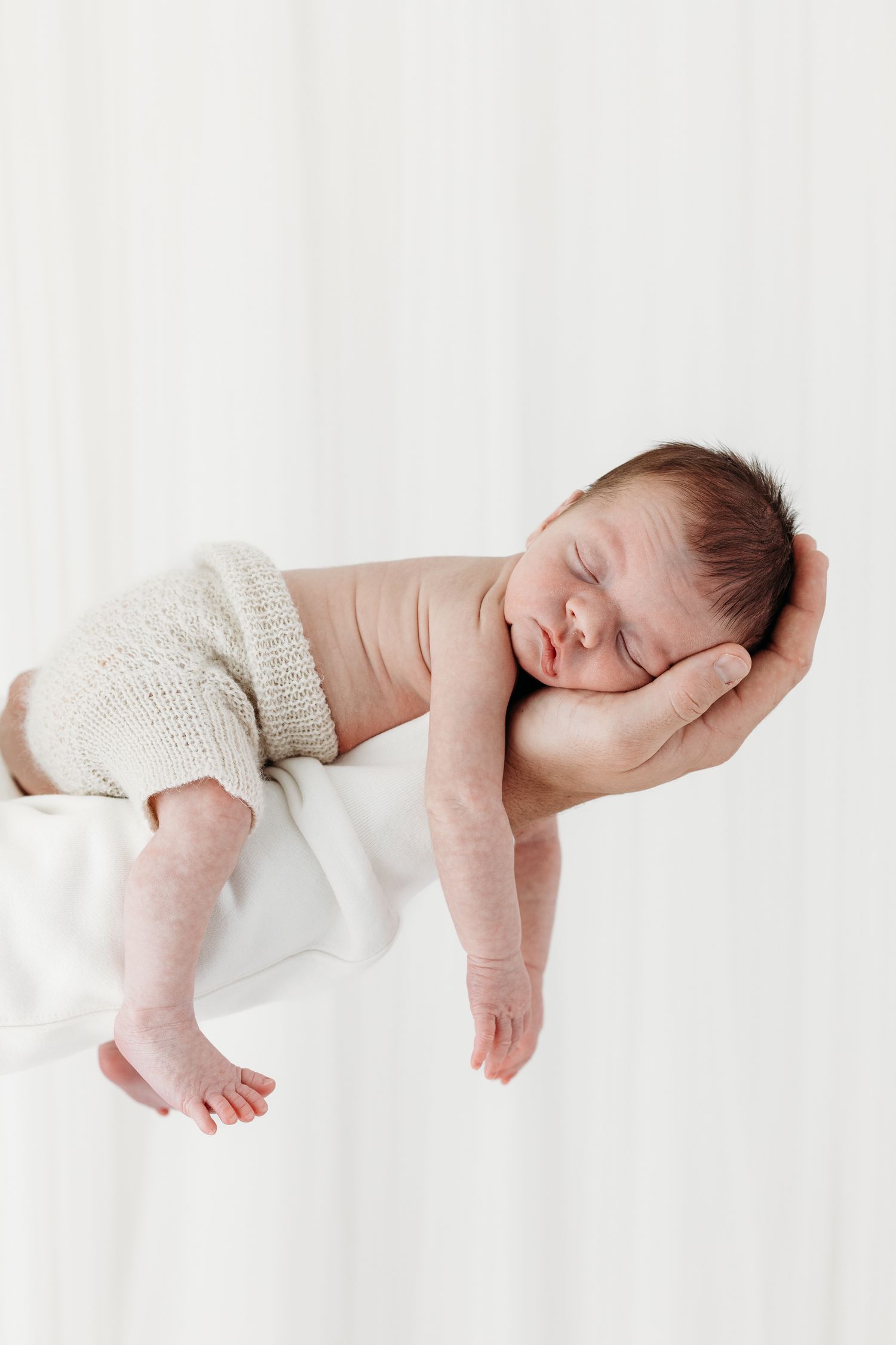Baby portraits in Mapperley studio, Nottingham newborn photographer capturing peaceful first days with timeless style.