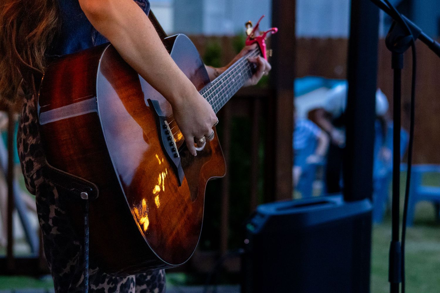 a close up image of someone playing the guitar