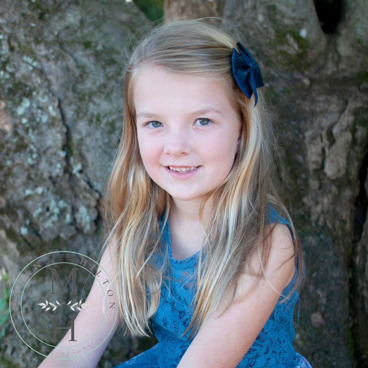 photo of girl sitting near tree at morven park