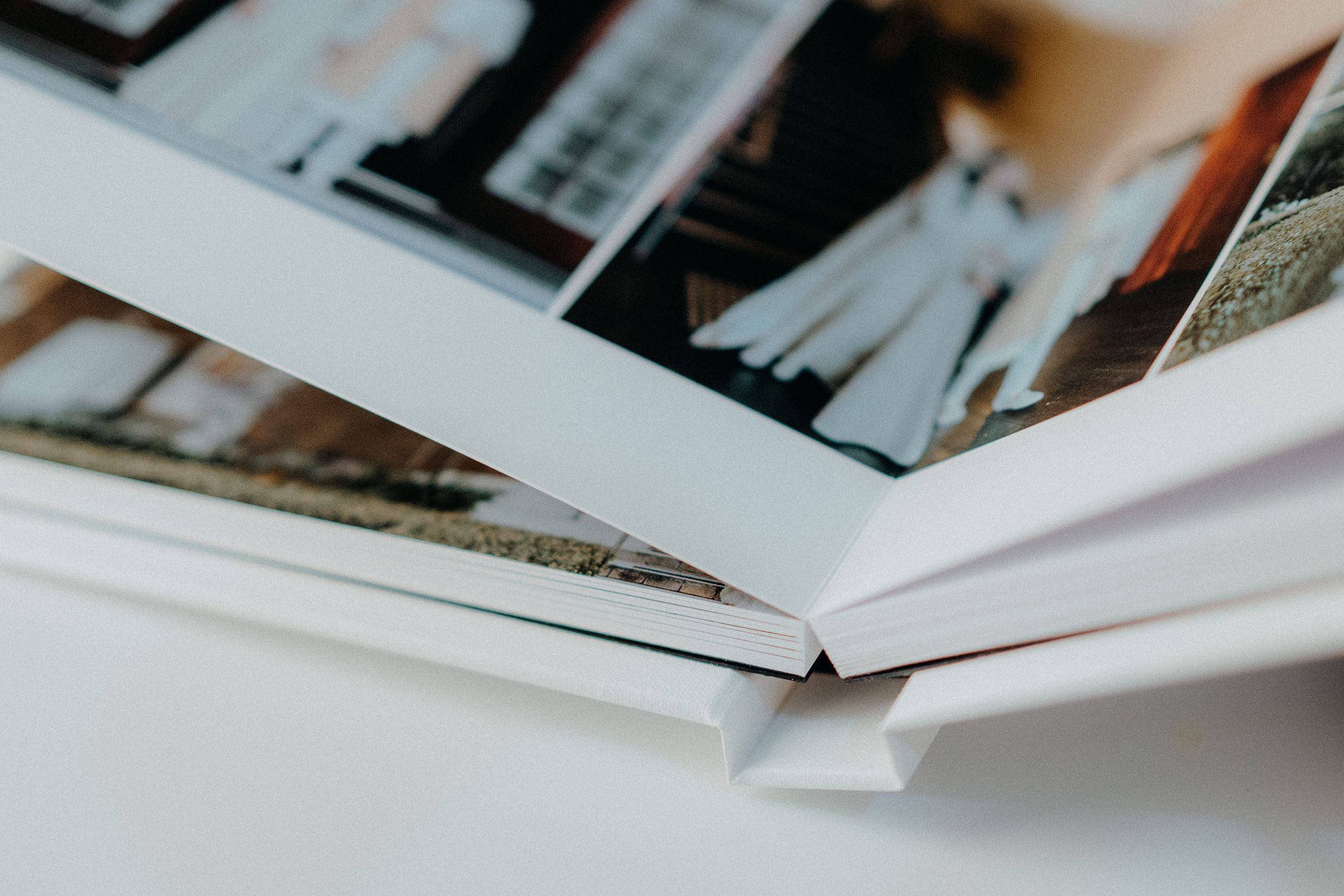 Close-up detail of an open photo album showing the binding and pages.