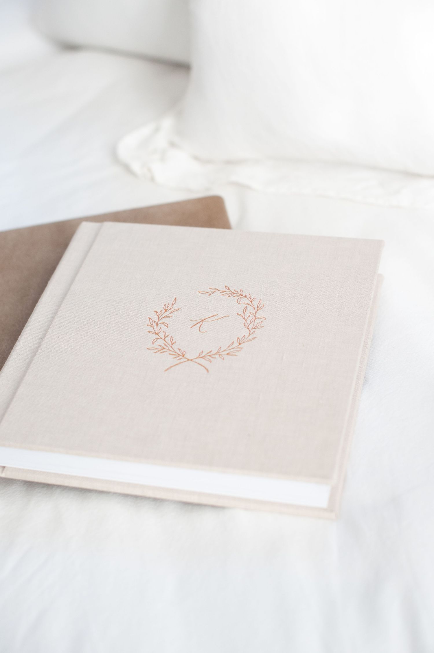 A series of delicate white wedding photos arranged in an album showing bouquets and romantic details.