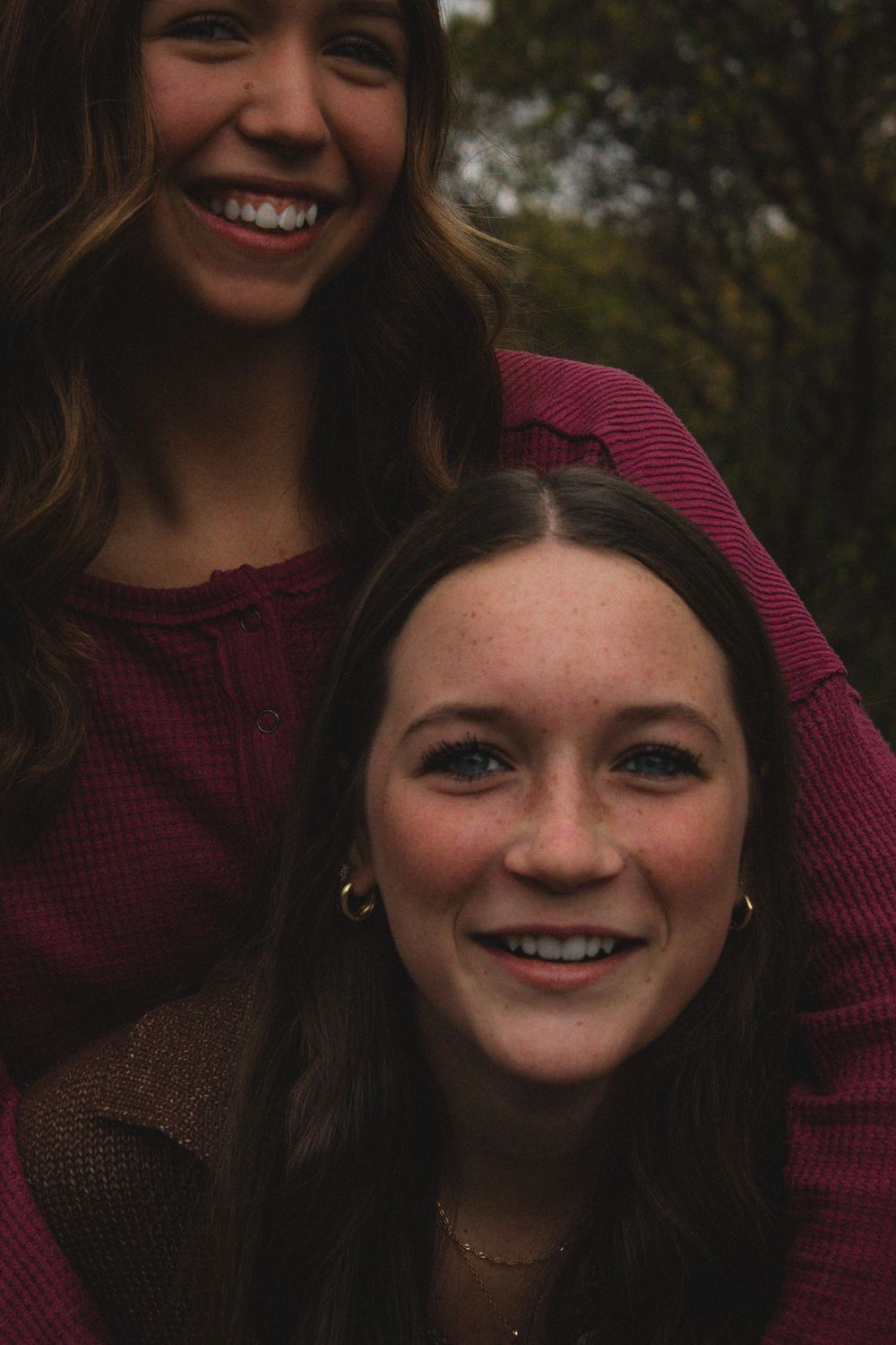 two friends caught in the midst of a piggyback ride