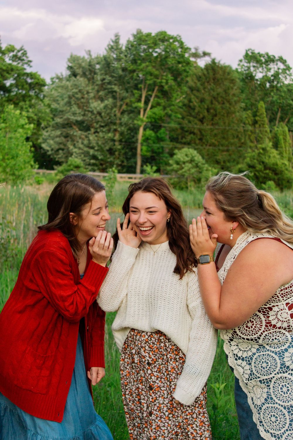 three friends telling secrets
