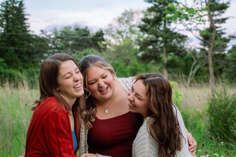 three friends laughing
