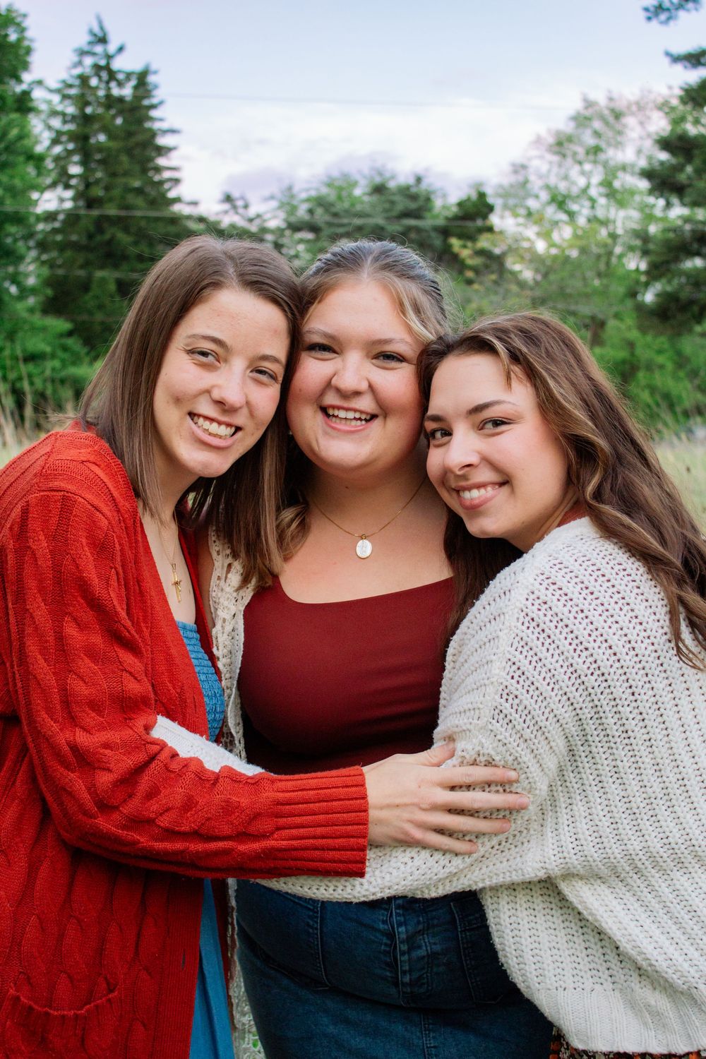 three friends wearing matching outfits