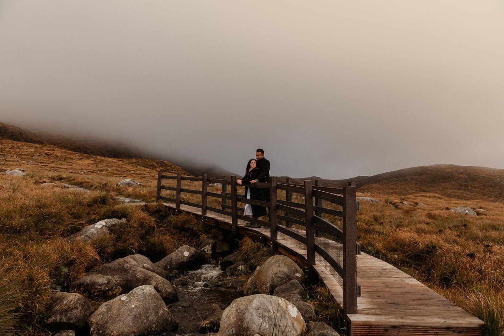 Couple standing together on Diamond
Hill hike during an adventure photo session in Connemara