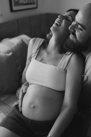 Black and white artistic photo series showing intimate moments of a person reclining in monochromatic lighting.