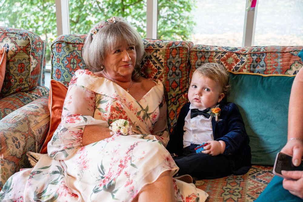 A sequence of images showing people sitting on floral patterned furniture in a living room setting.