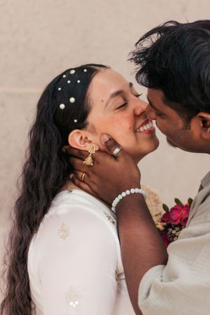 Romantic wedding moment with pearl hair accessories and gold rings  | Motherhood + Family Photographer Westminster, CO