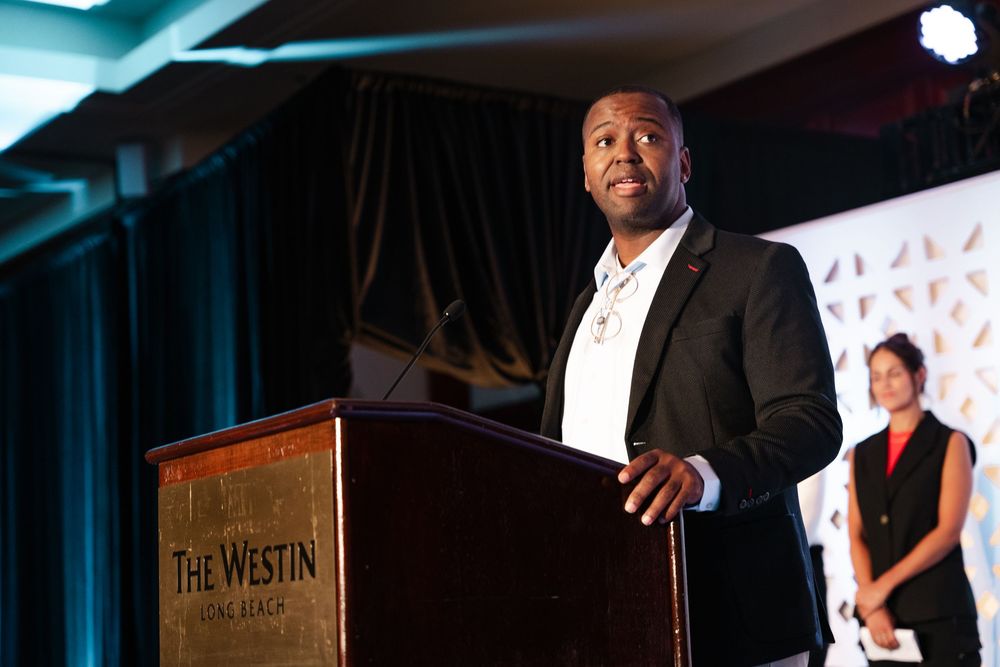 Man speaking at podium at The Westin Long Beach during a formal event.
