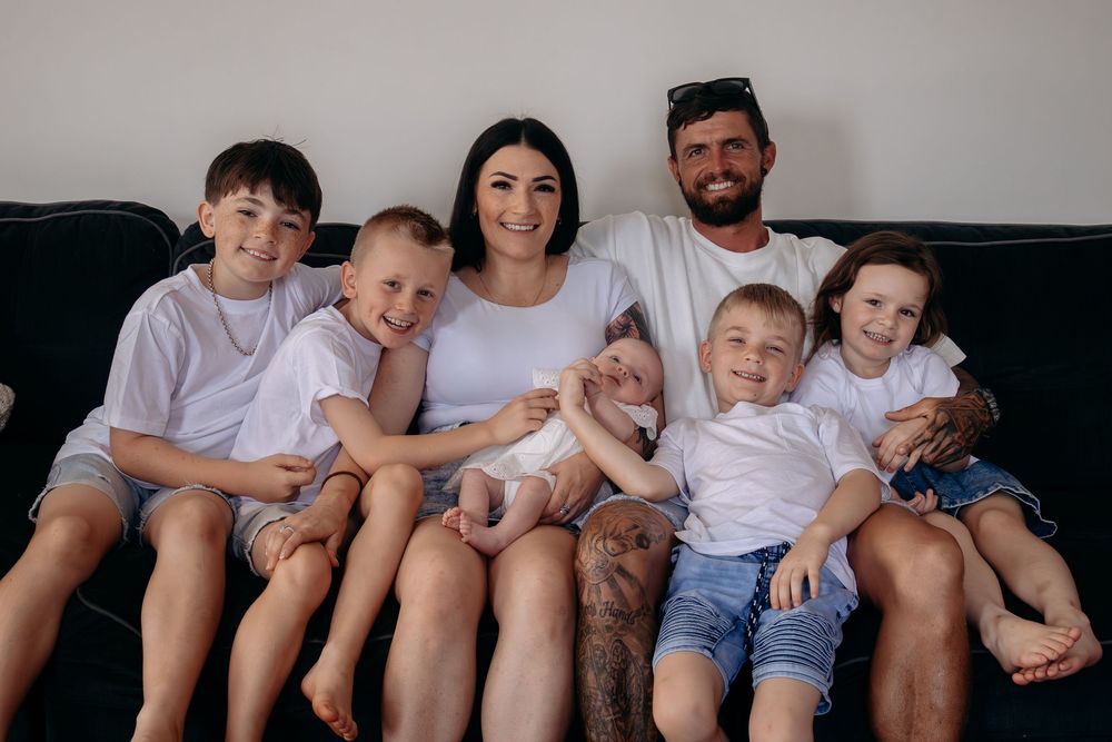 Natural family photography documenting everyday love in a beautiful in-home setting
