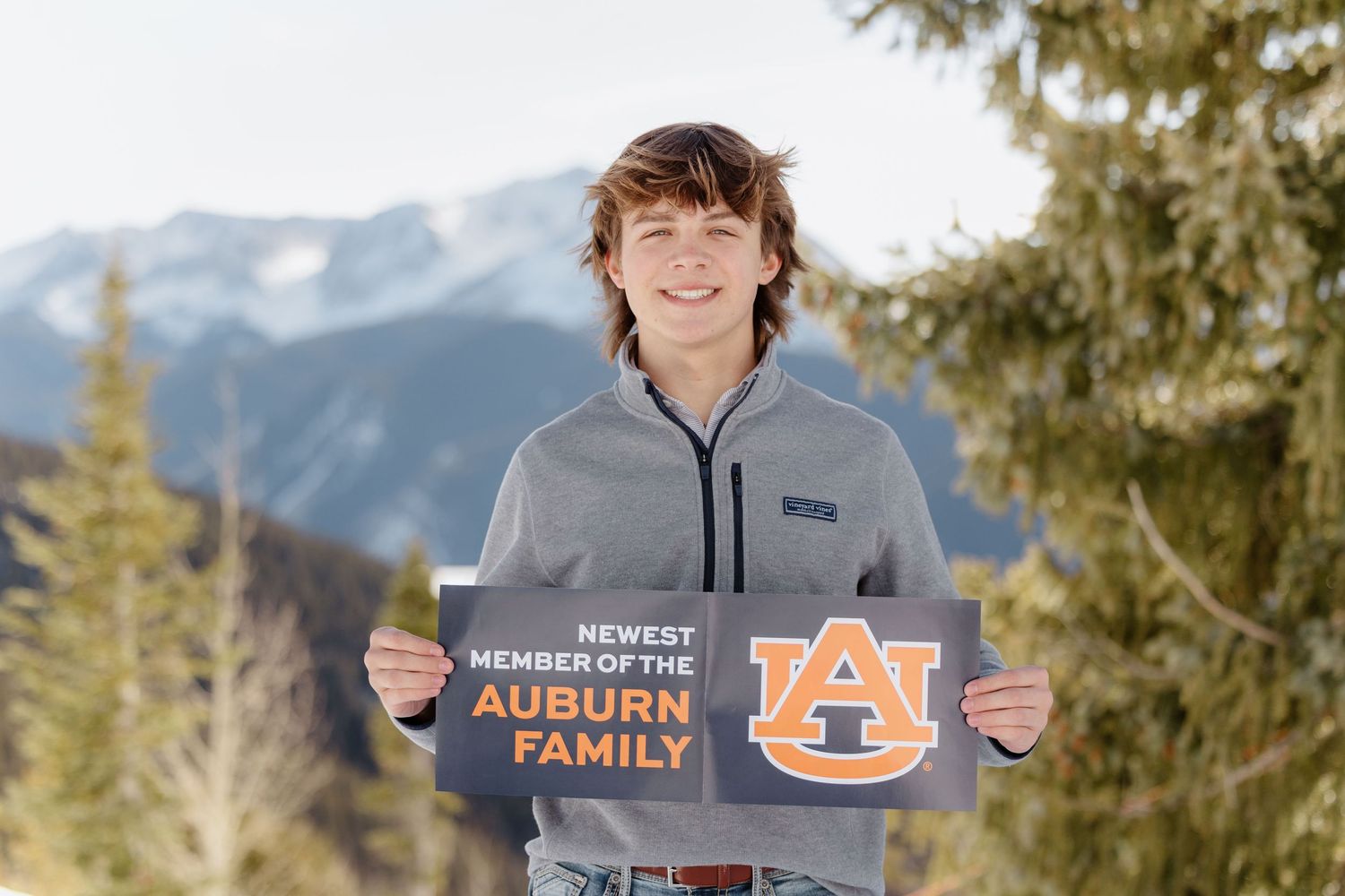 A boy taking his senior photos with Kelly Elizabeth Photography, a photographer that specializes in Aspen Seniors.