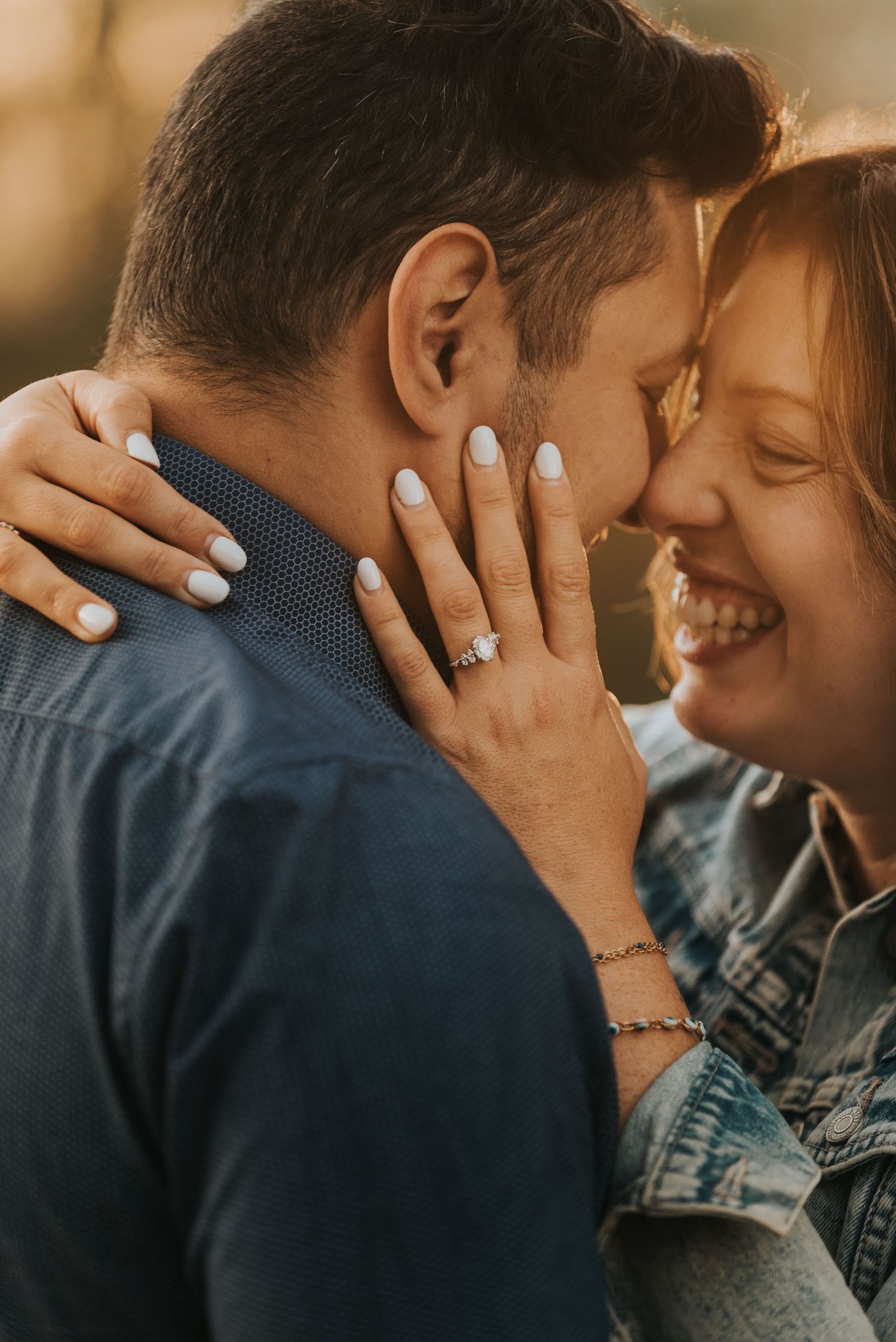 A romantic sequence of close-up shots showing a couple sharing an intimate moment while wearing blue and gray clothing.