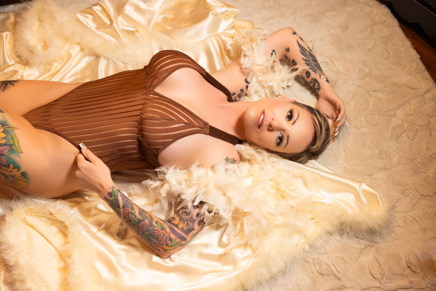 Lady laying down on satin robe