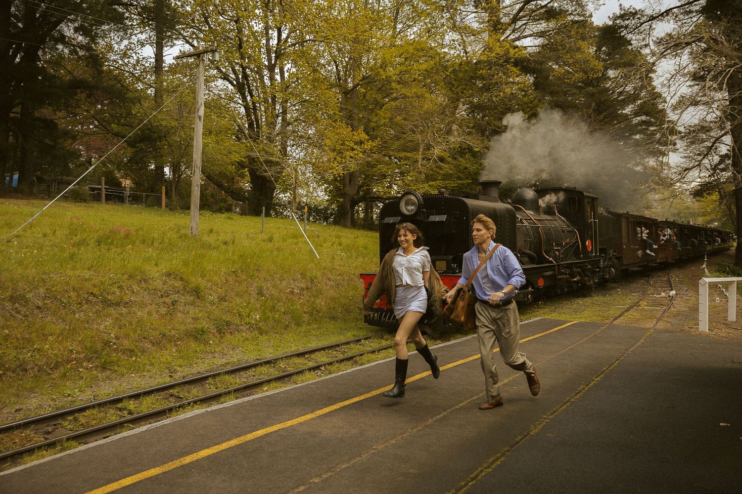 Romantic cinematic couples photos bat Emerald Lake Park with Puffing Billy in the background