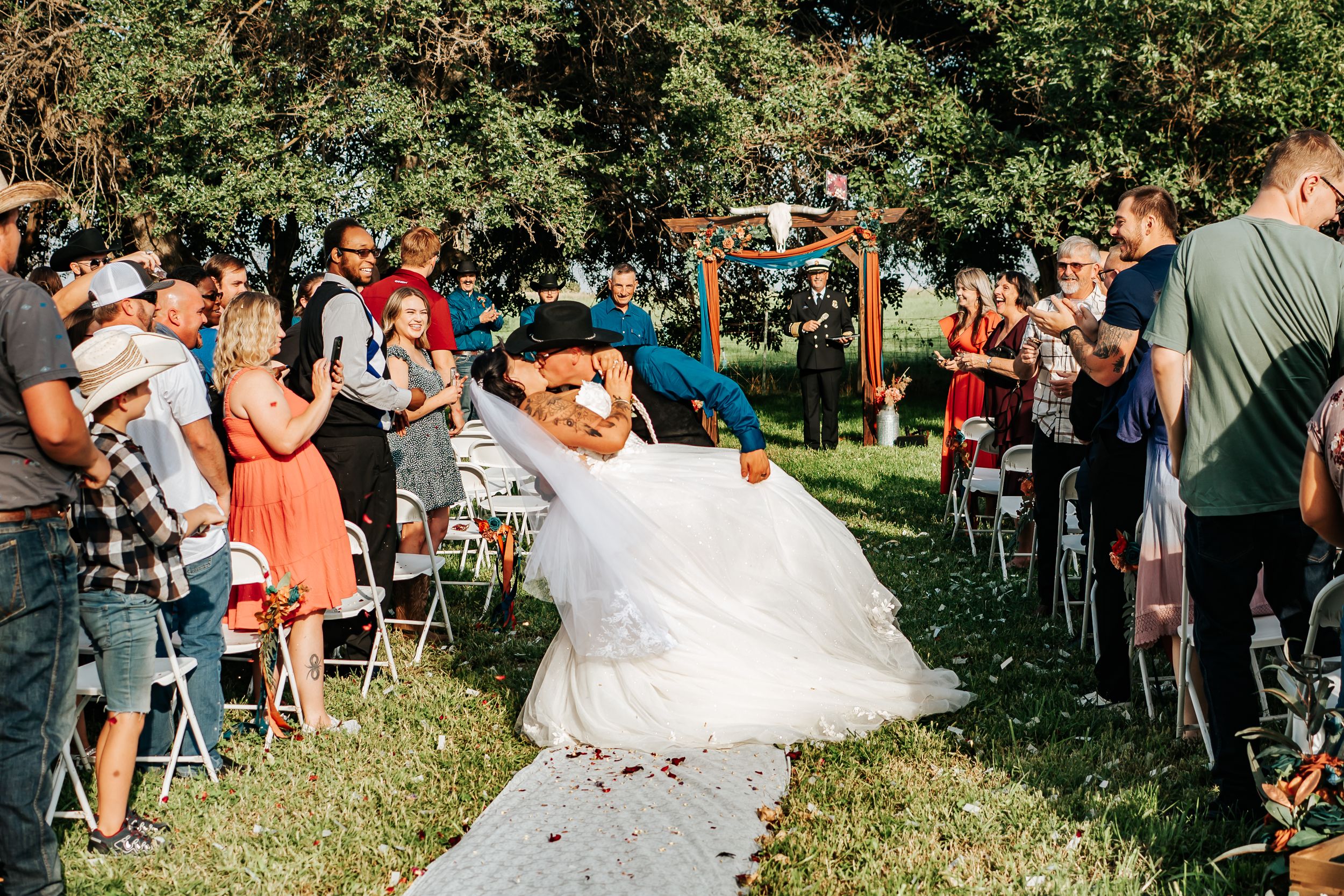 Eastern Oregon wedding ceremony in a green pasture.