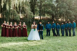Wedding party members stand in a line in an Eastern Oregon pasture