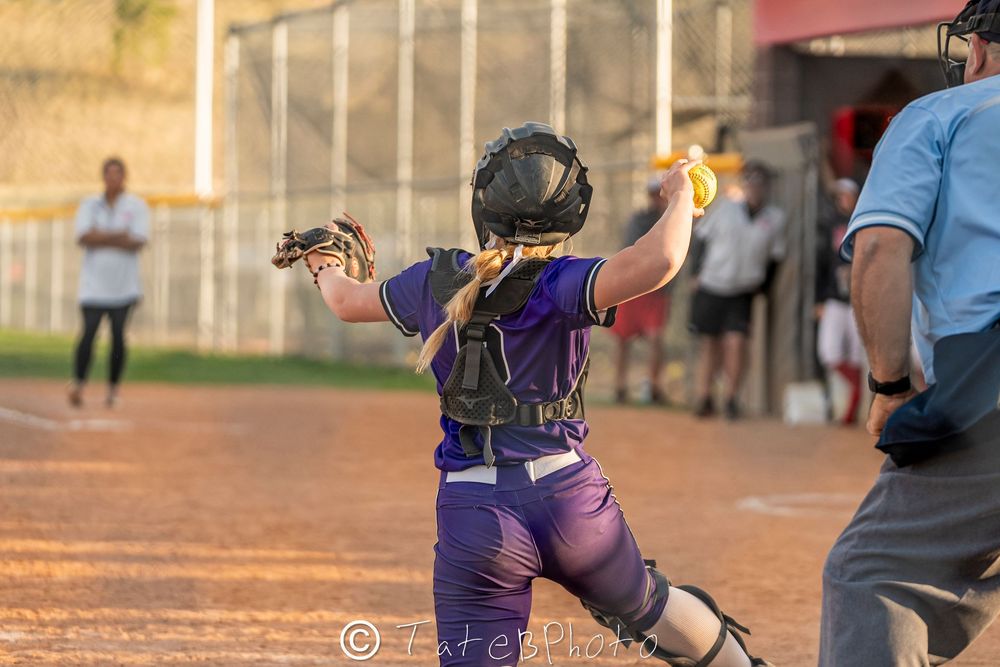 Girls softball player throwing the ball