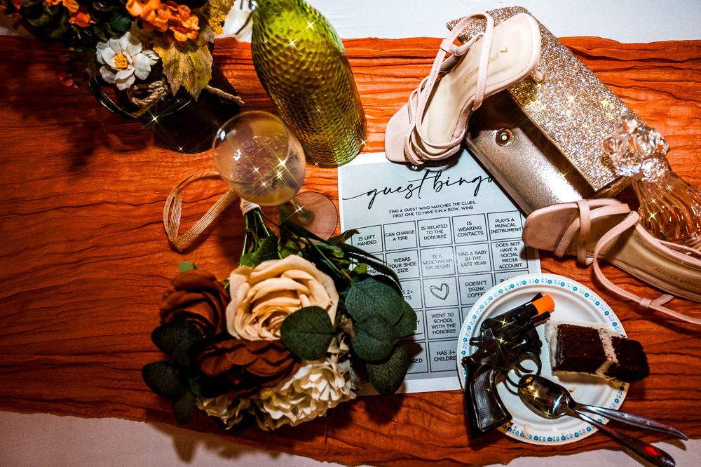 A series of table settings with rustic decor, plates, and fall decorations arranged on a wooden surface.