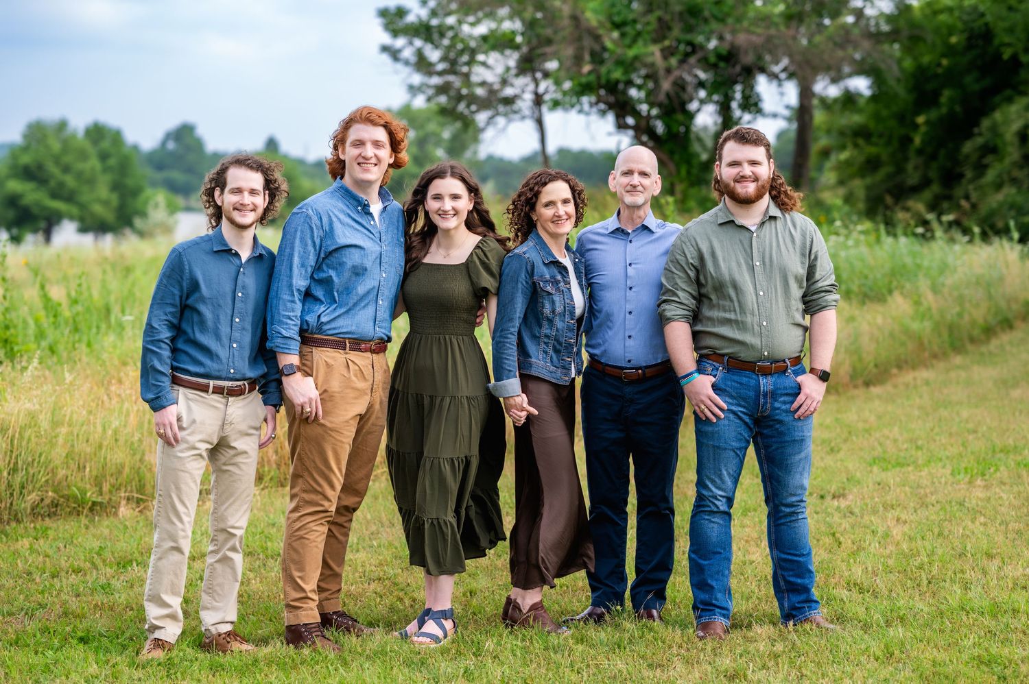 parents and their adult children posing next to white rock lake in dallas by mesquite family photographer