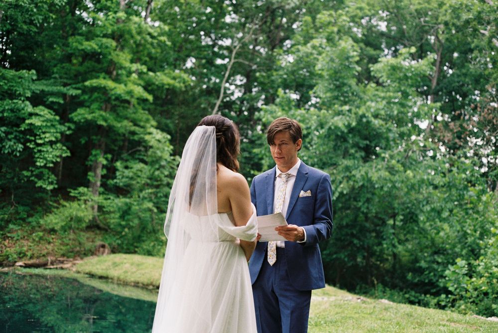 bride and groom read vows in st Louis
