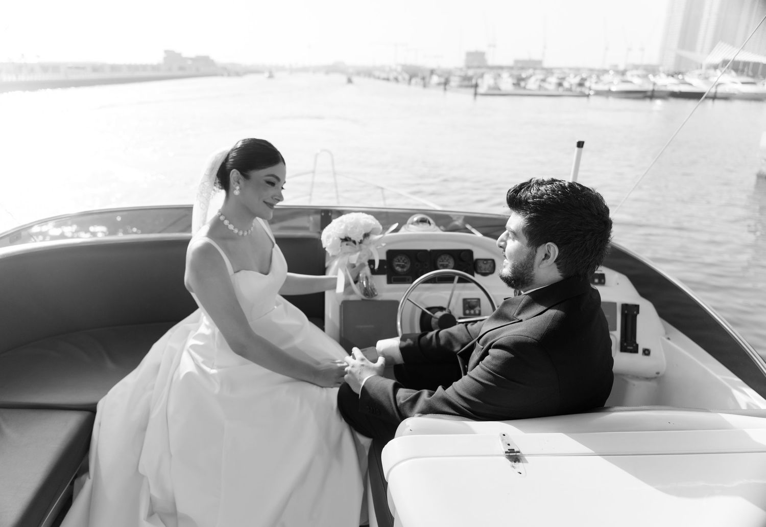 A group of candid photos shows passengers enjoying views and having fun while seated in a boat across multiple frames.